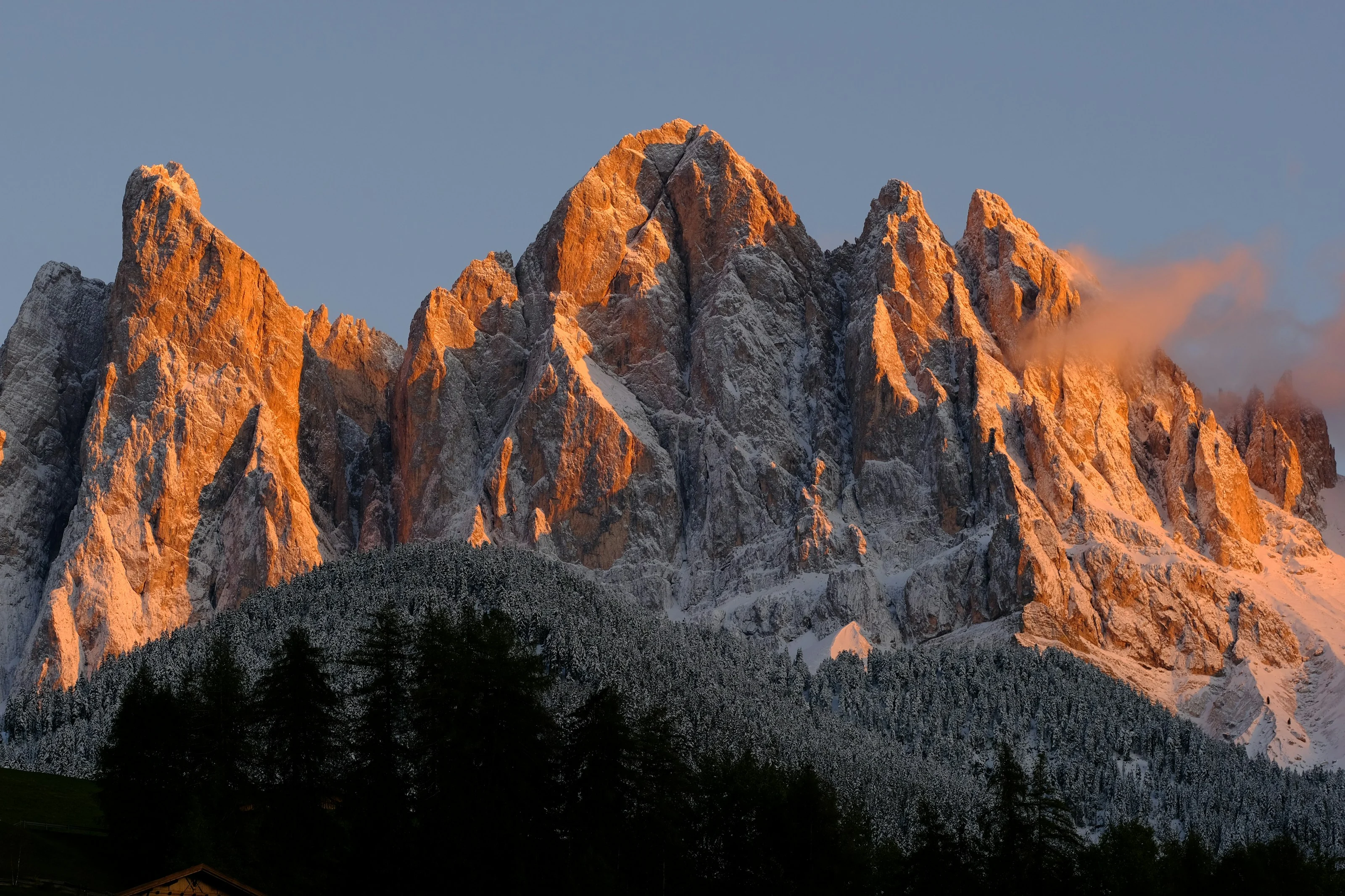 Limestone peaks of the Dolomites lit orange at first light